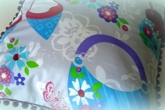 Polštářek s bambulkami